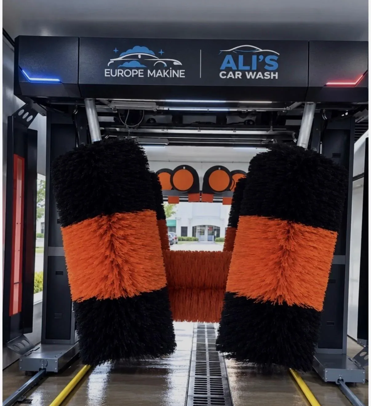Car wash tunnel with a Europe Makine and Ali's Car Wash header, orange and black brushes, and a Boca Raton label
